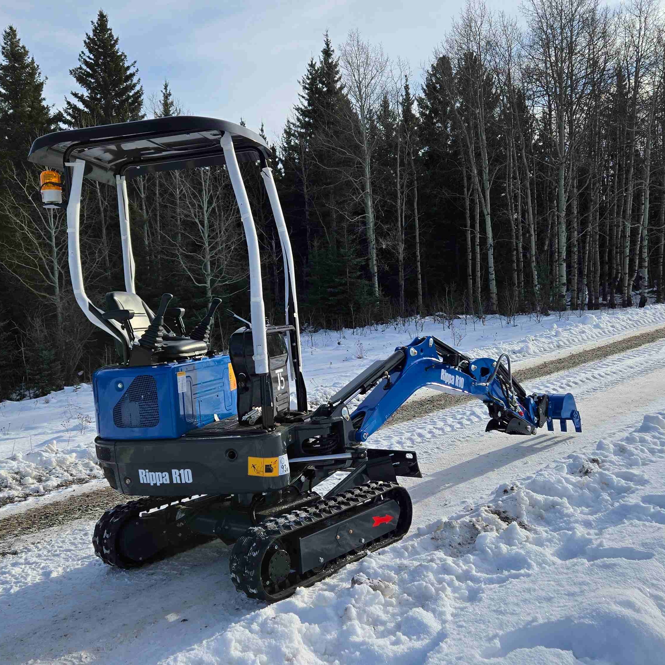 Rippa R10 one ton mini excavator on a snowy job site in Canada showing compact digging power for tight spaces with JoyT5 support