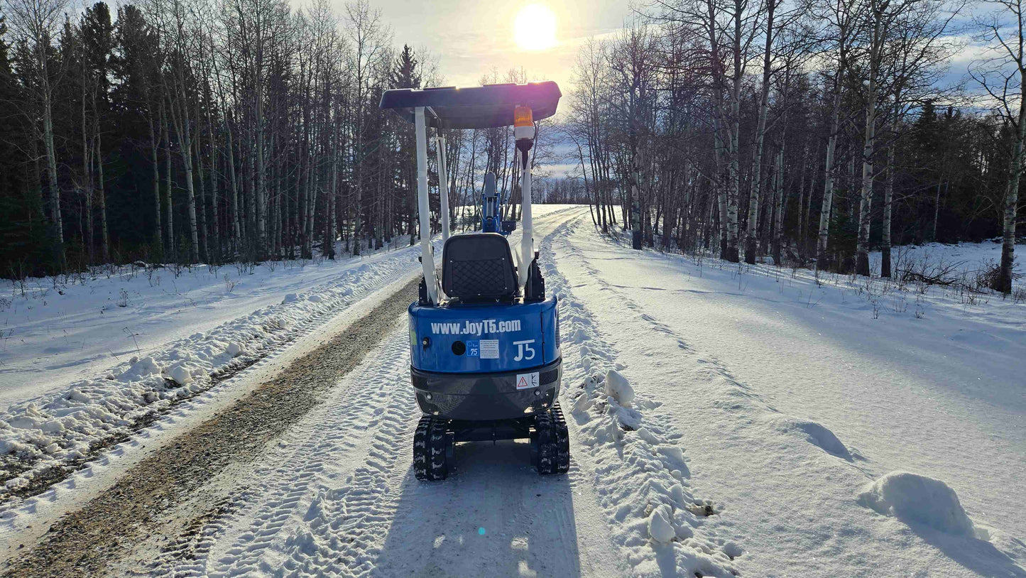 Rear view of Rippa R10 1 ton mini excavator for sale in Canada from JoyT5 on a snowy road showing a compact excavator for tight spaces and landscaping projects
