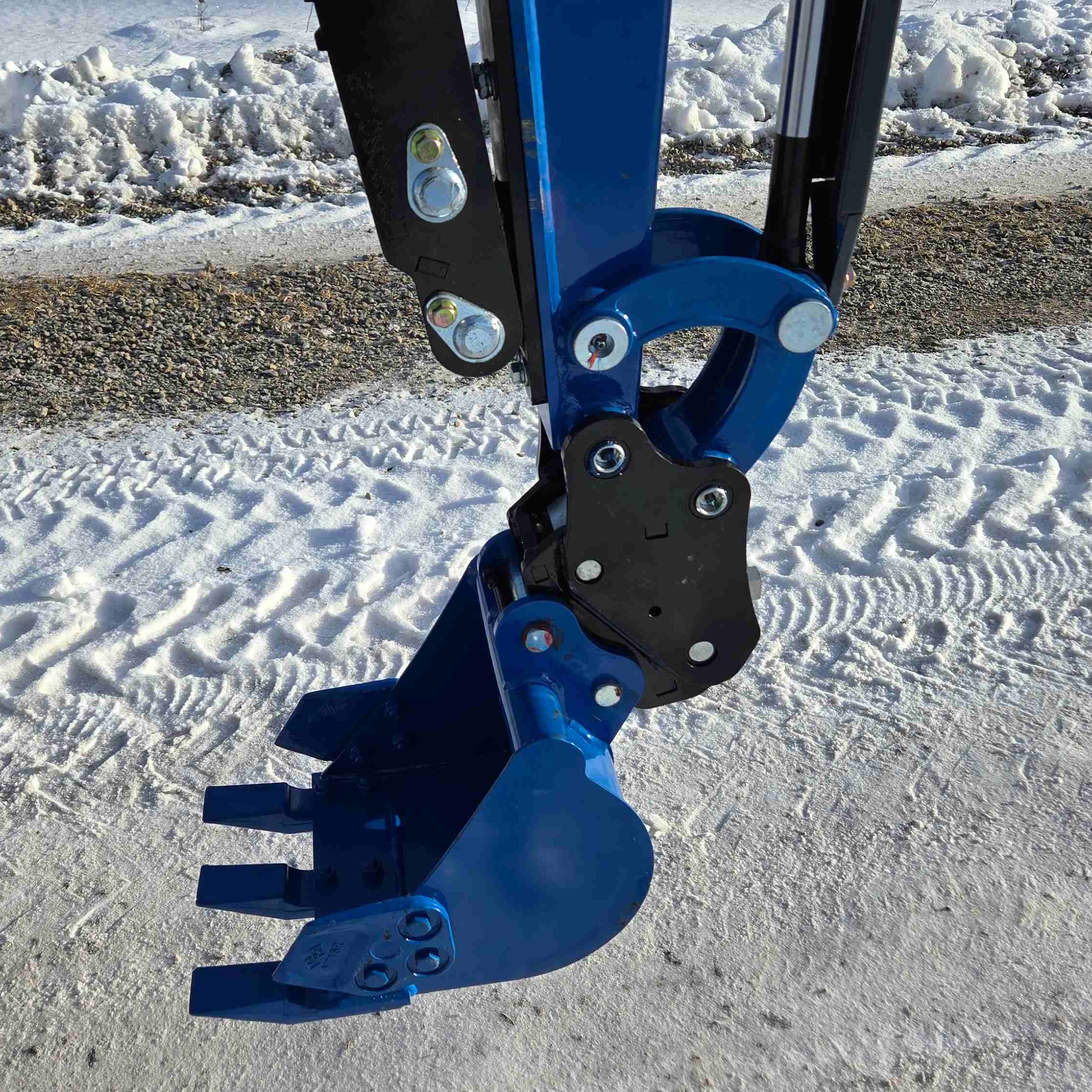 Rippa R10 1 ton mini excavator bucket close up working on snow in Canada with JoyT5 dealer support showing strong grip compact excavator small digger for tight spaces and landscaping