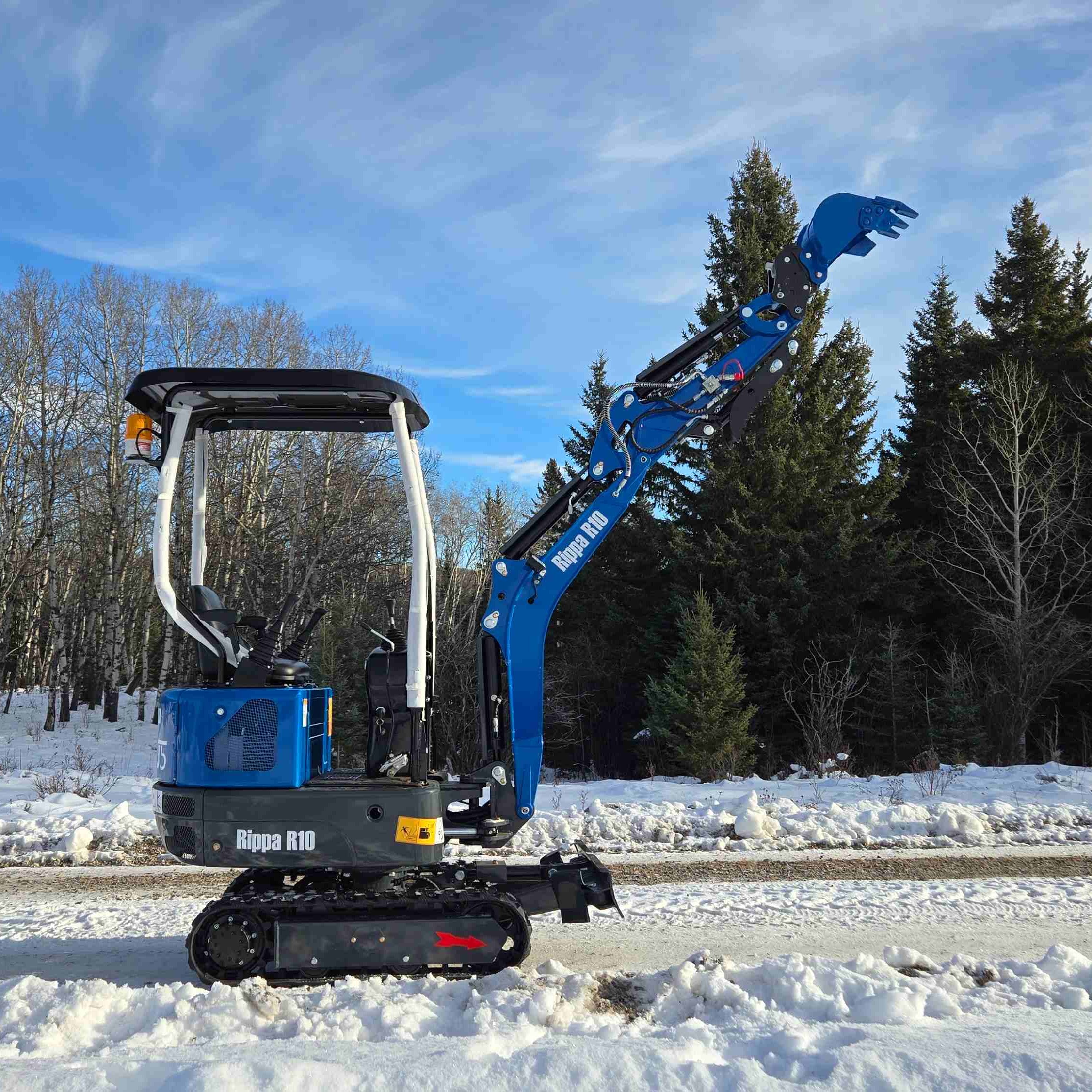 Rippa R10 1 Ton Mini Excavator for Sale in Canada compact excavator side view working in snow ideal for tight spaces landscaping and backyard projects from JoyT5 dealer in Canada