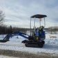 Rippa R10 1 Ton Mini Excavator for Sale in Canada working beside a snowy forest road with JoyT5 showing compact digging capability for small excavator for tight spaces Canada