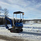 Rippa R10 mini excavator by JoyT5 parked on snowy ground in Canada, compact 1 ton digger ideal for small construction and landscaping projects.

