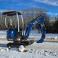Rippa R10 mini excavator on snowy road in Canada, compact and durable construction digger by JoyT5 built for small digging projects.
