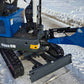 Close-up of Rippa R10 mini excavator hydraulic arm and front blade on snowy ground in Canada, compact and durable digger by JoyT5 for construction work.