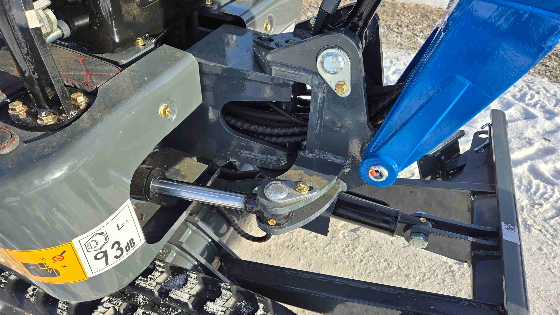 Close up view of Rippa R10 mini excavator hydraulic cylinder and pivot assembly in Canada by JoyT5, showing compact strong construction design.

