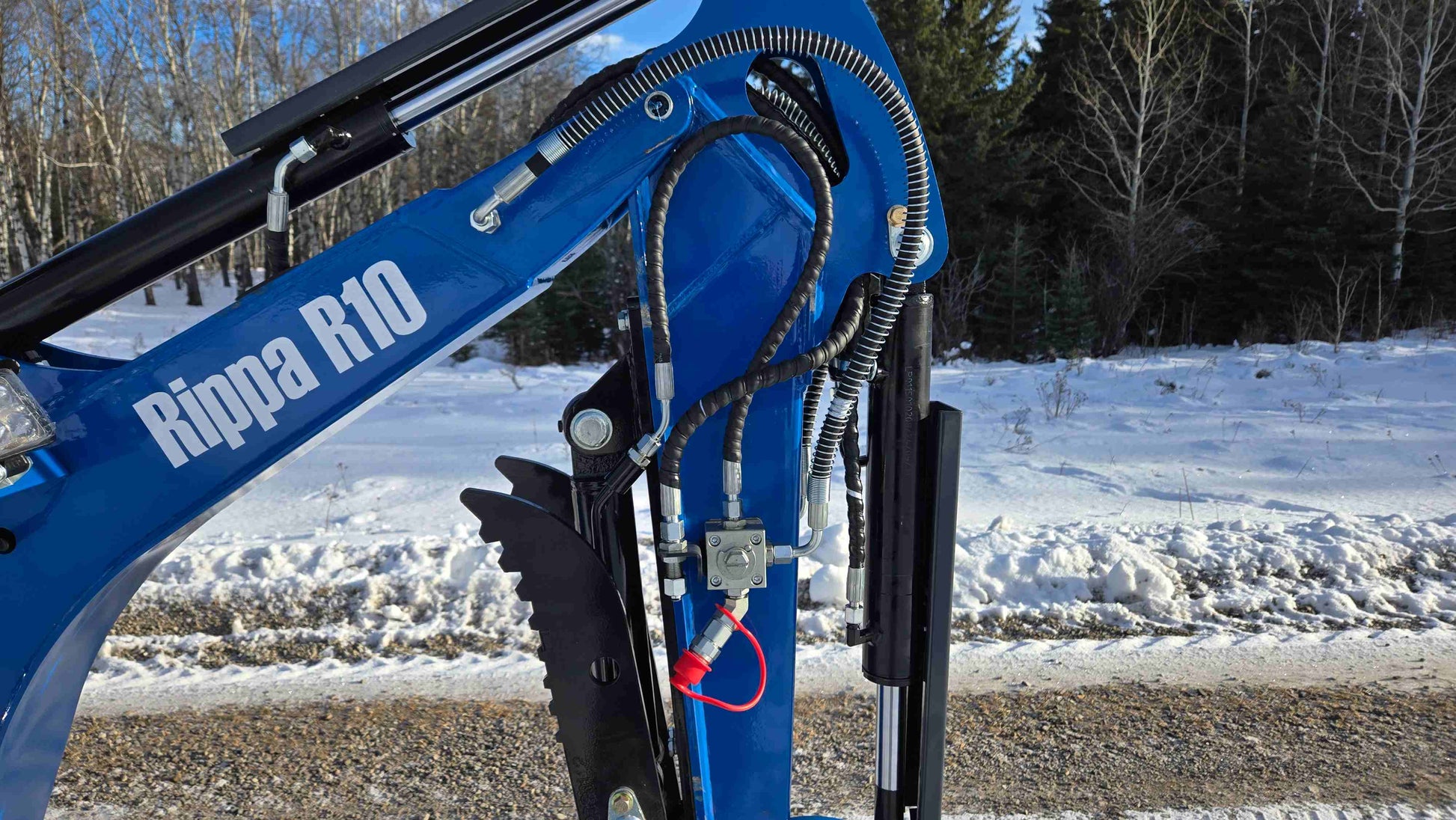 Close-up of Rippa R10 mini excavator hydraulic lines and boom arm in Canada, compact and durable construction machine by JoyT5 for small digging projects.