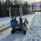 Rippa R10 mini excavator on snowy winter road in Canada, compact construction digger by JoyT5 showcasing durability and performance in cold conditions.