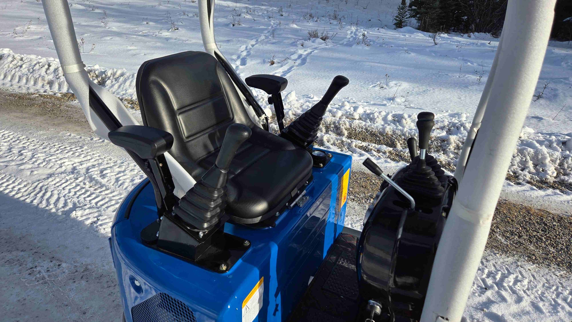 Compact Rippa R10 mini excavator operator seat and joystick controls in Canada from JoyT5 showing comfortable design for small construction landscaping and backyard projects