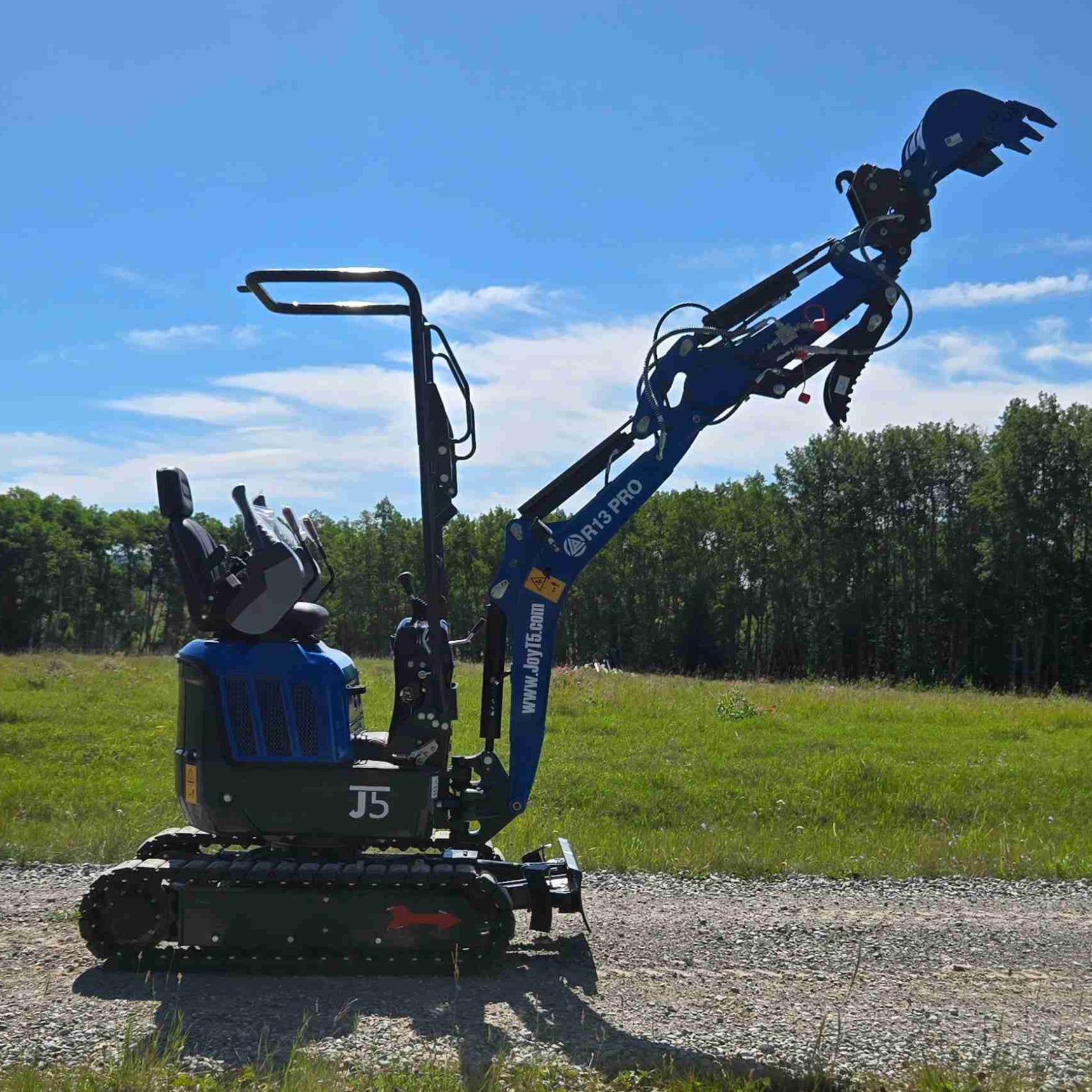 Rippa R13 1.3 ton mini excavator for sale in Canada | Compact mini excavator with raised arm and bucket for construction and landscaping supported by JoyT5