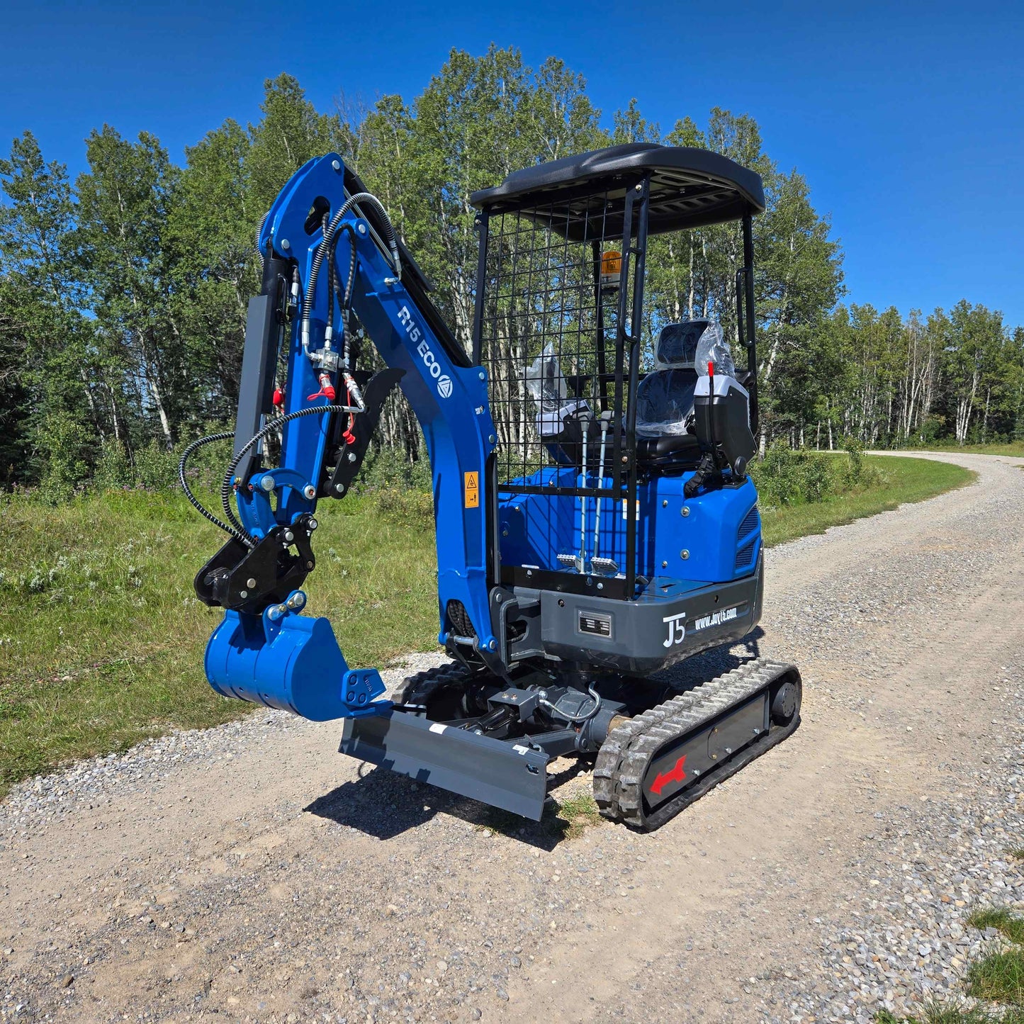 Rippa R15 1.5 Ton Mini Excavator for Sale in Canada compact excavator on gravel road used as a small excavator for construction canada and landscaping mini excavator canada with kubota engine mini excavator working in a residential jobsite supported by JoyT5 dealer