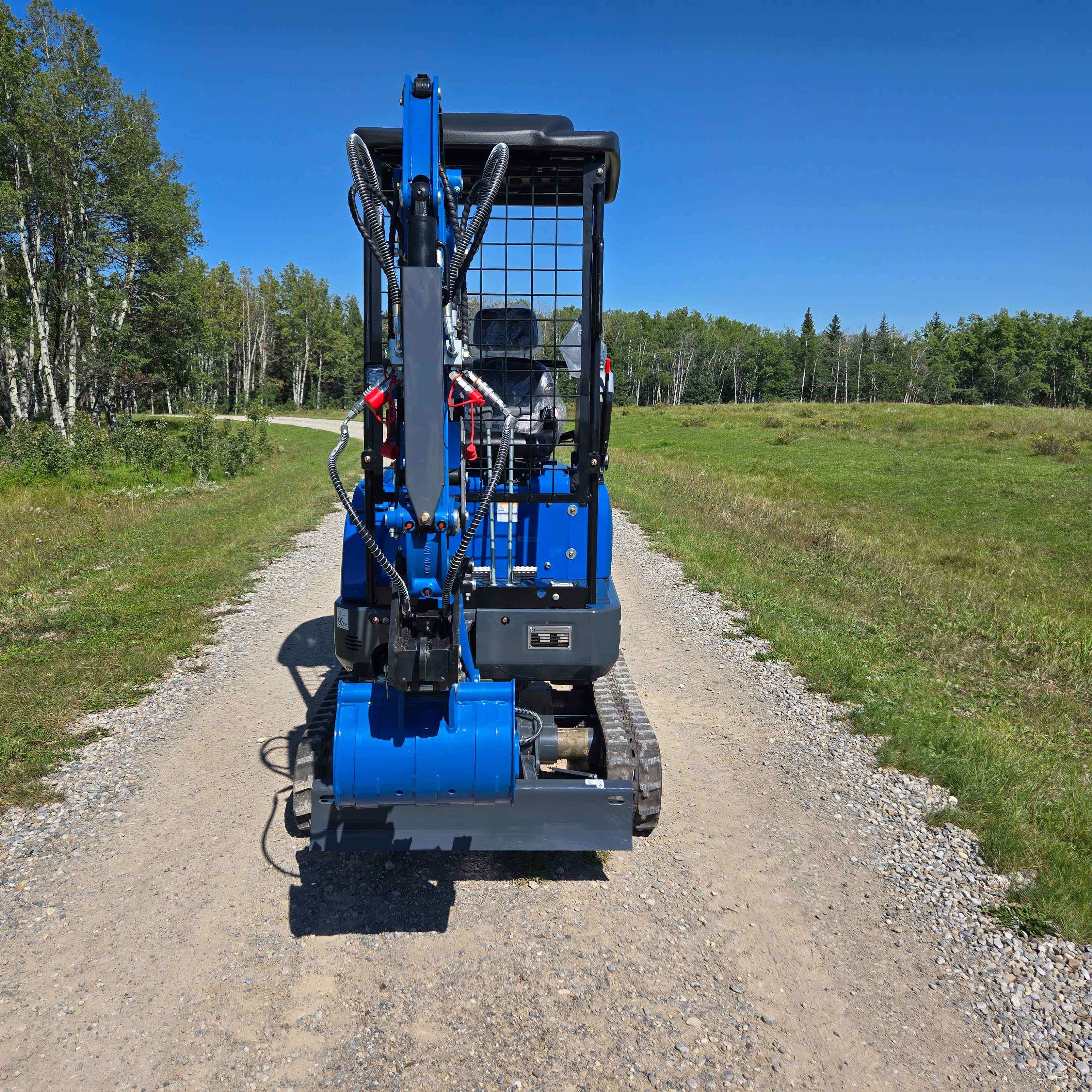 Compact mini excavator Canada rear view showing small digging machine suitable for tight spaces landscaping and construction projects