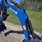 Close up of Rippa R15 mini excavator  for sale arm and hydraulic system on gravel road