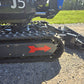 Close-up view of rippa r15 mini excavator for sale rubber track and undercarriage on gravel surface