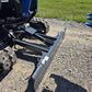 Closeup of Rippa R15 mini excavator dozer blade on gravel ground