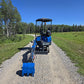 Rippa R15 mini excavator for sale rear view with extended bucket on rural gravel road