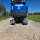 Rippa R15 small mini excavator undercarriage and rubber tracks on gravel road in Canada with JoyT5 compact construction equipment
