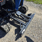 Close up view of rippa r15 mini excavator for sale dozer blade and hydraulic attachment on gravel surface