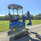 Compact rippa r15 mini excavator for sale side and rear view with operator seat and digging bucket on gravel road