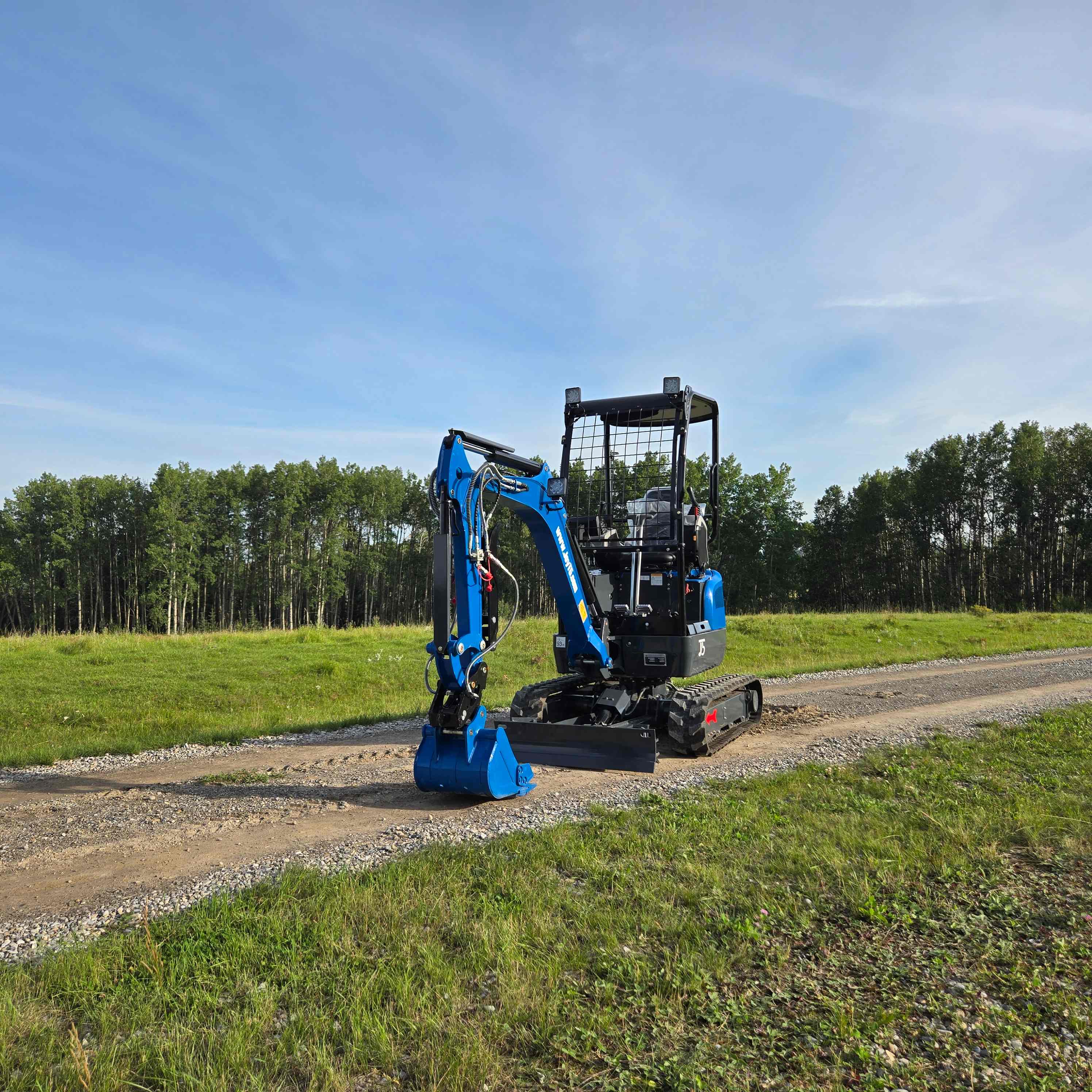Rippa R18 1.8 ton mini excavator from JoyT5 working beside a gravel road in Canada used for landscaping and small construction projects with kubota d902 engine