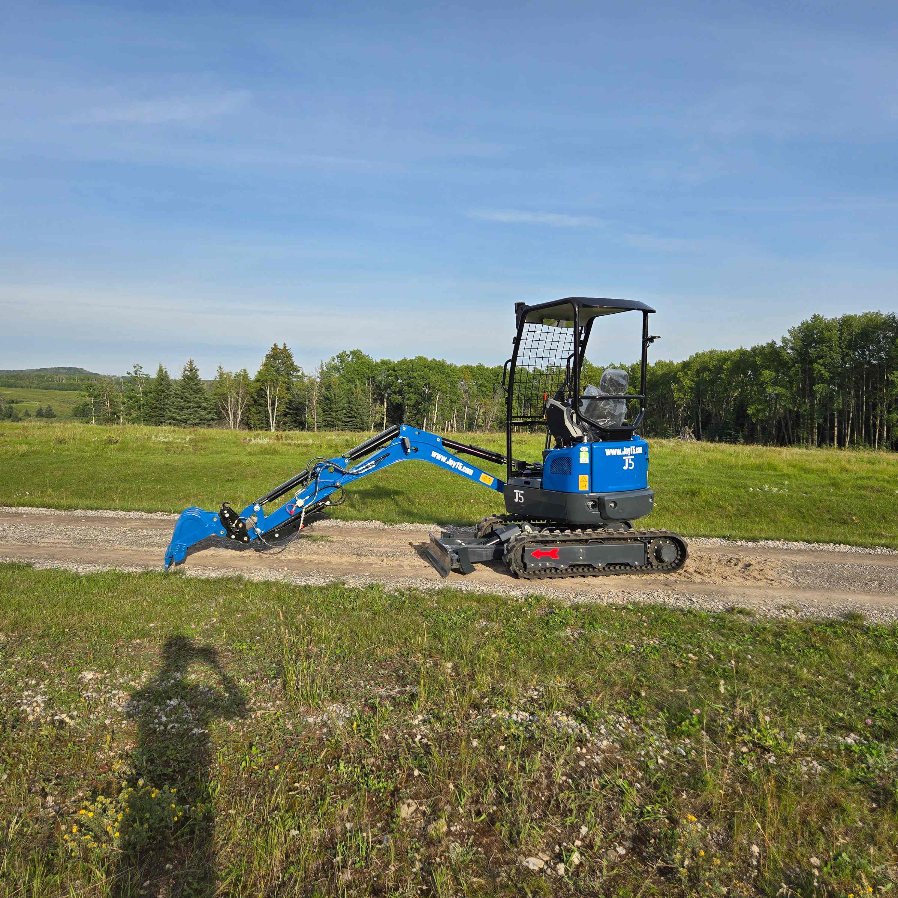 Rippa R18 1.8 ton mini excavator working on gravel road in Canada from JoyT5 compact landscaping construction digger