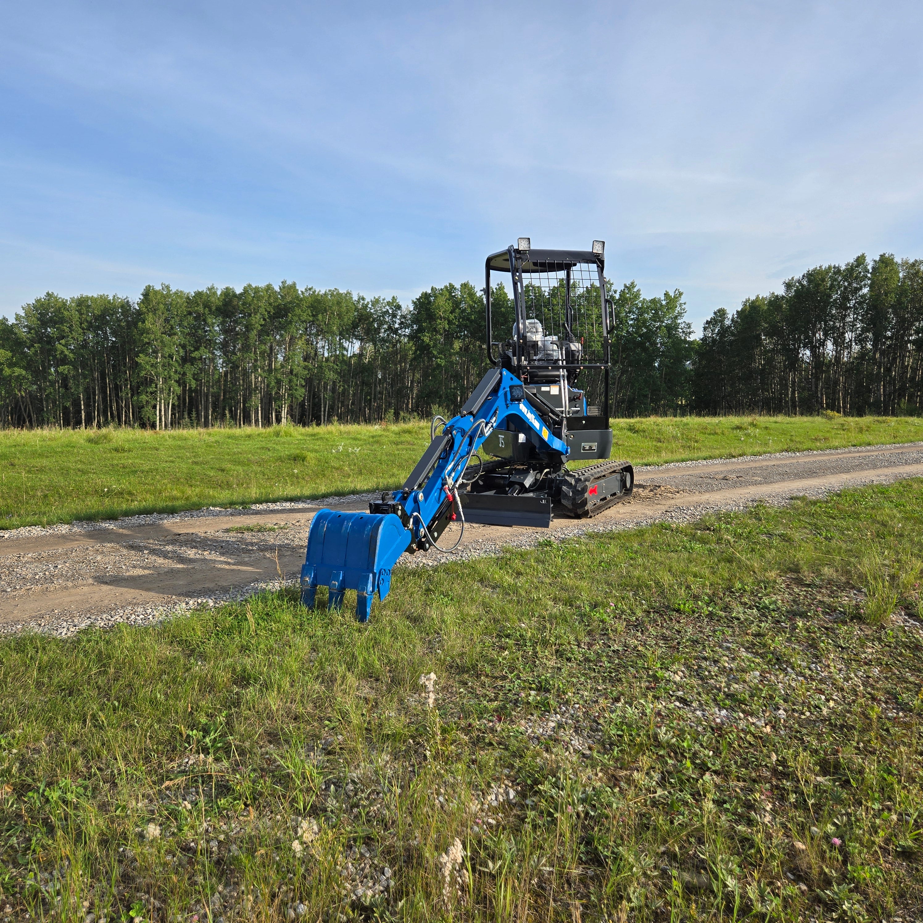 Front view of Rippa R18- mini excavator with digging arm extended forward, JoyT5 
Heavy Equipment Canada