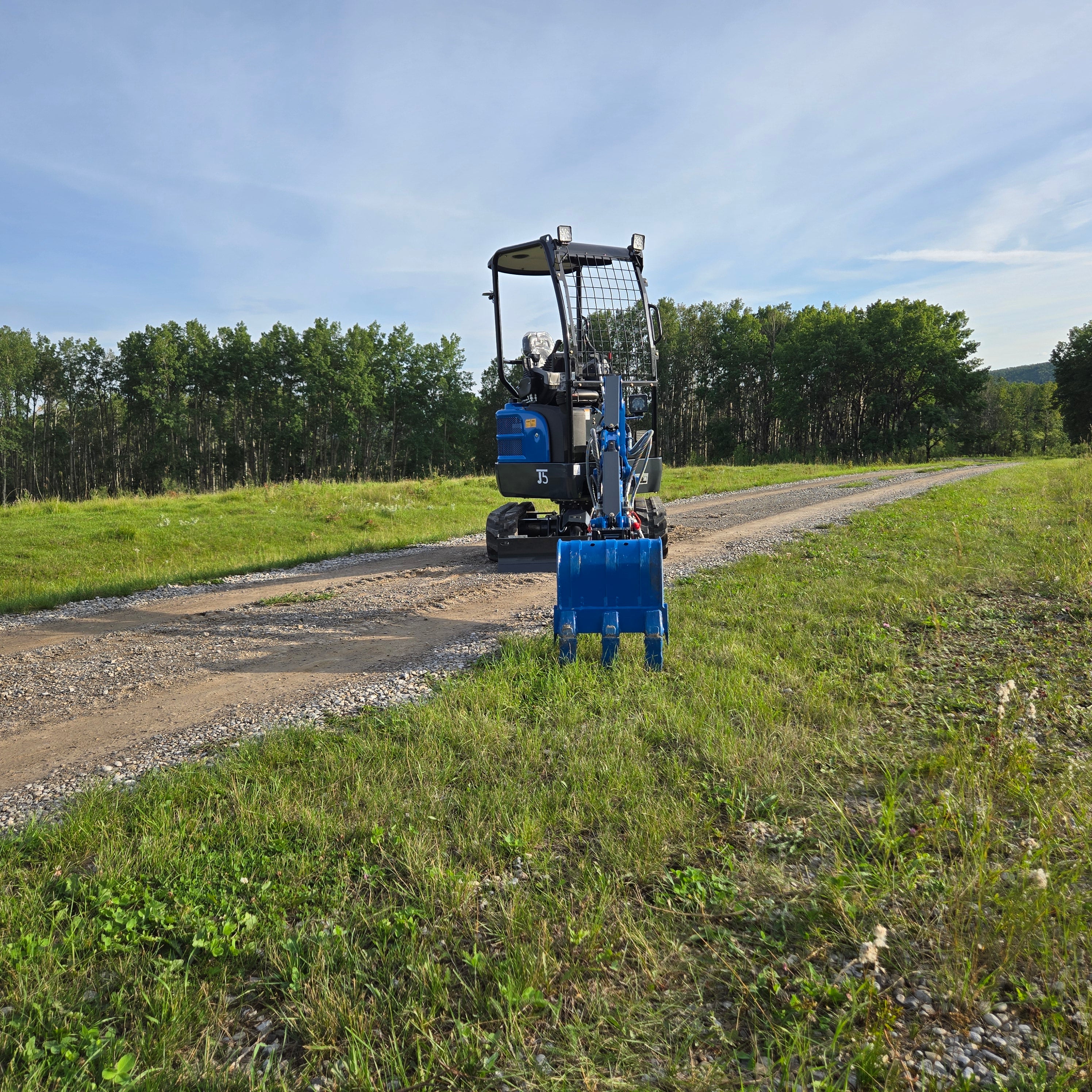 Rear view of Rippa R18- mini excavator with digging arm centered, JoyT5 Heavy Equipment Canada