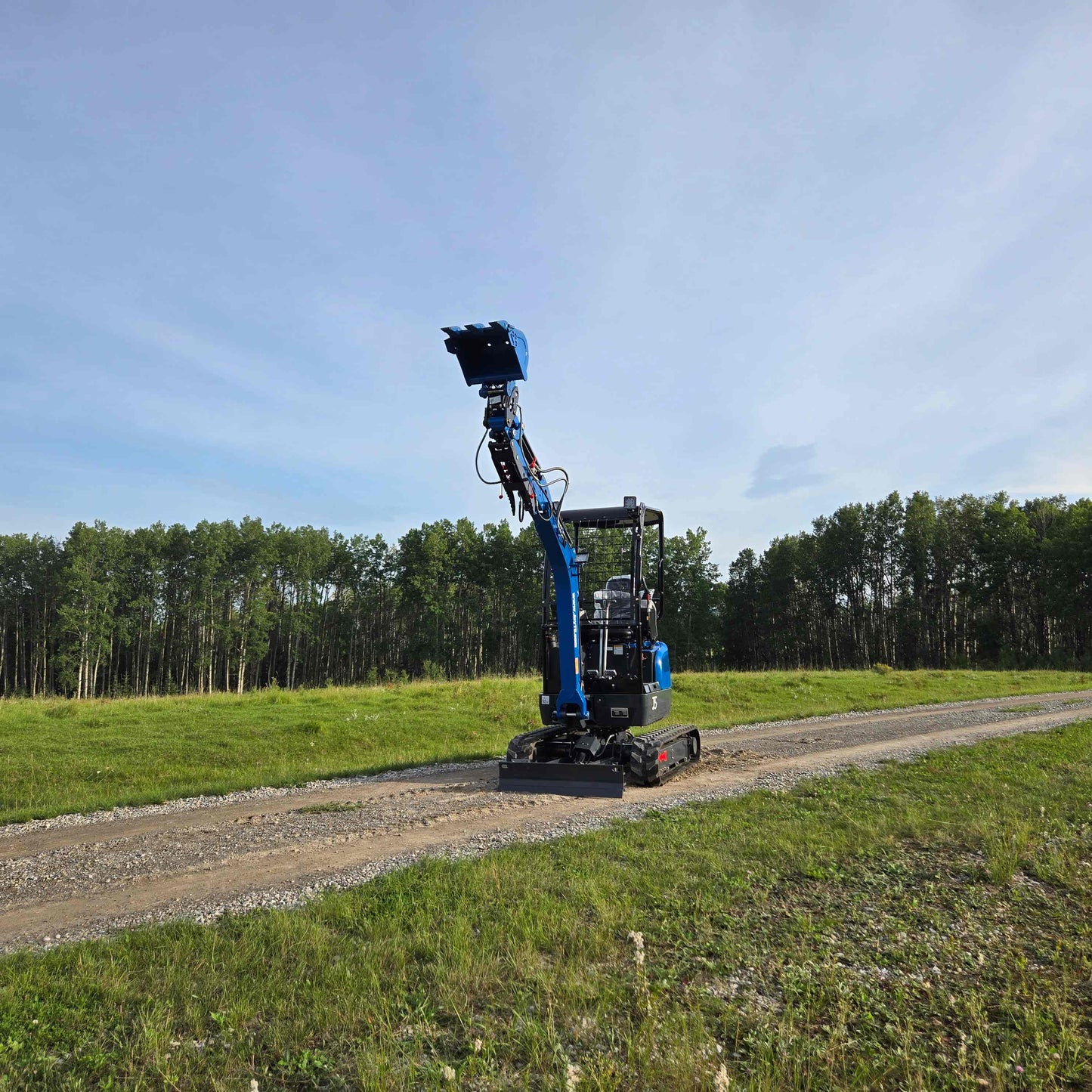Rippa R18 1.8 Ton Mini Excavator for Sale in Canada working on a gravel road with raised boom JoyT5 compact excavator for construction in Canada