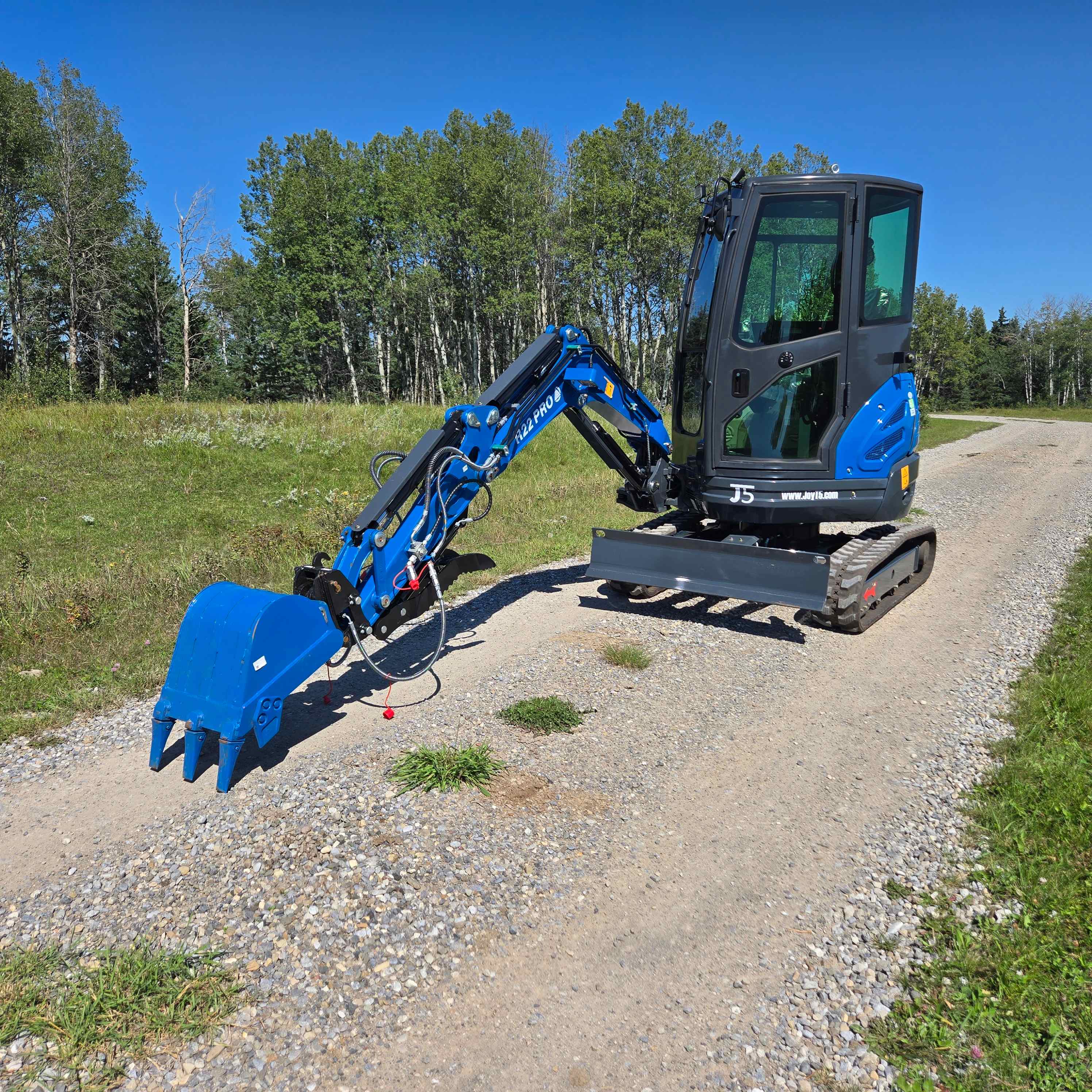 Rippa R22 2 ton mini excavator for sale in Canada from JoyT5 extended digging arm working position on gravel road compact excavator for landscaping construction and Yanmar engine performance