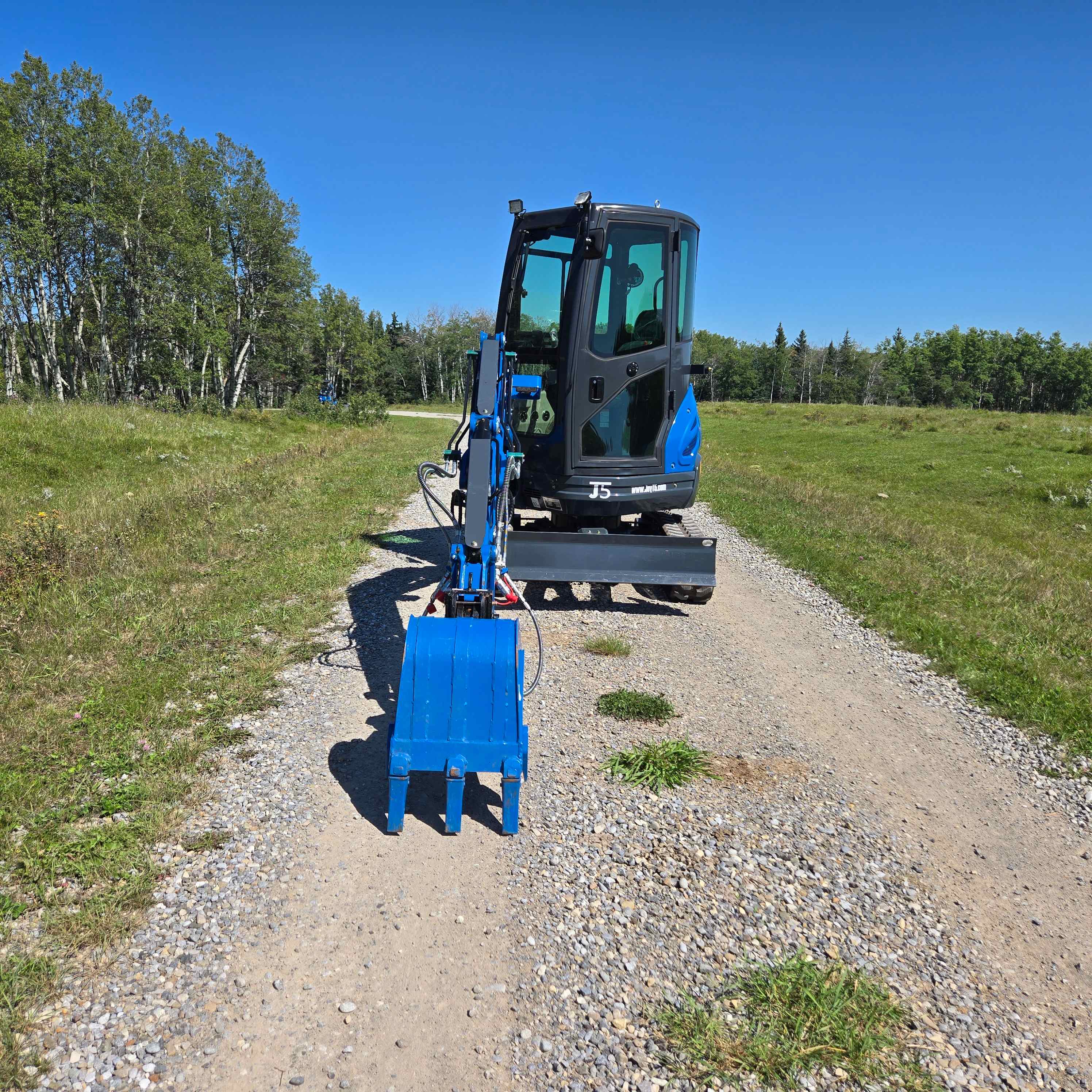 Rippa R22 2 ton mini excavator for sale in Canada from JoyT5 front view with digging bucket on gravel road compact excavator for landscaping and construction with Yanmar engine