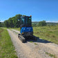 Rippa R22 Mini Excavator back view on countryside road – Compact Mini Excavator For Sale.
