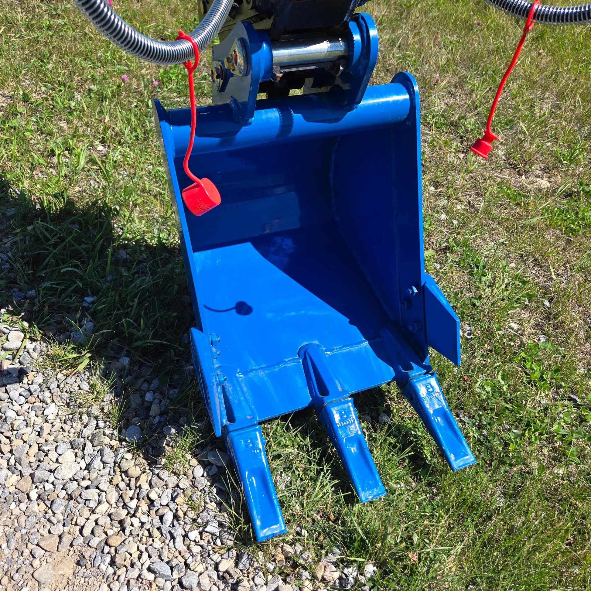 Close-up view of heavy-duty bucket on Rippa R22 mini excavator – compact 2 ton excavator for sale in Canada with Yanmar engine, showing strong steel teeth for digging and loading.

