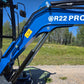 Rippa R22 mini excavator for sale boom showing hydraulic cylinder, hoses, and safety label for stable lifting performance.

