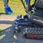 Close-up of Rippa R22 Mini Excavator for sale showing dozer blade, rubber tracks, and part of the digging bucket on gravel ground.
