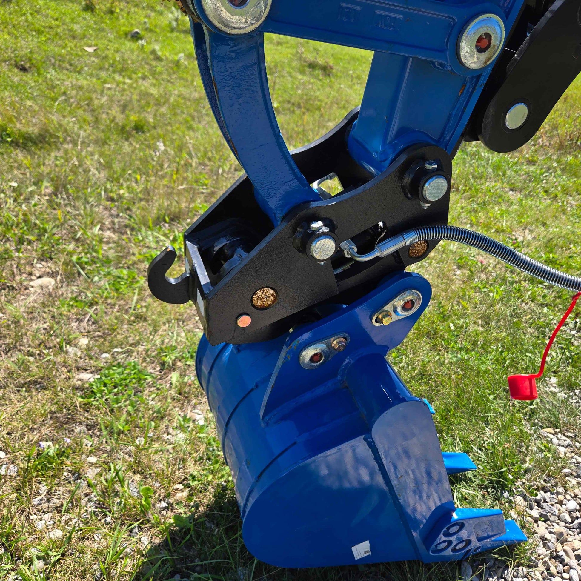 Close-up of hydraulic quick coupler system with digging bucket on a Rippa R22 mini excavator, for sale showing strong build and secure attachment.
