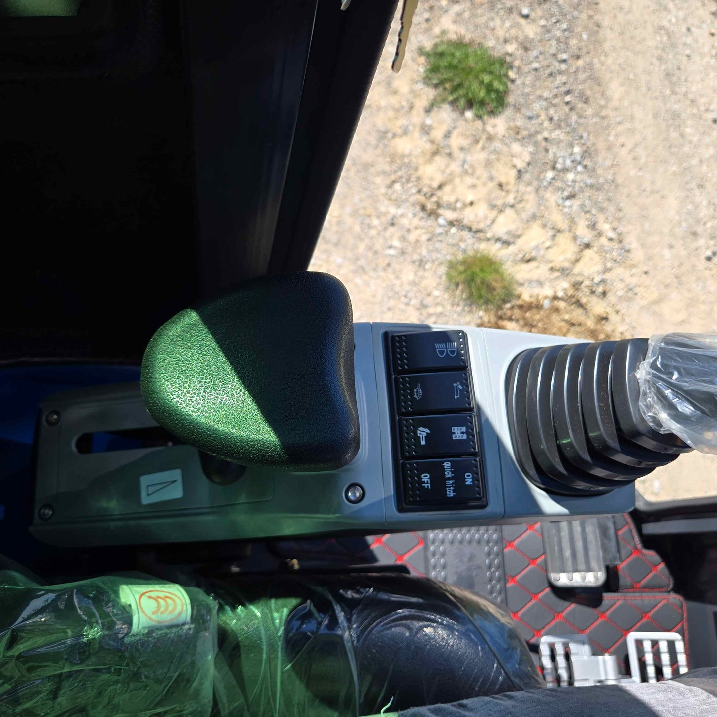 Close-up of joystick and function switches inside Rippa R22 mini excavator – compact 2 ton excavator for sale in Canada with Yanmar engine, designed for easy operator control.

