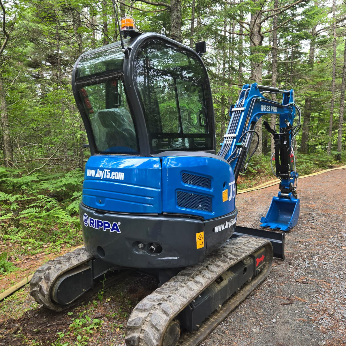 Rippa R32 3 Ton Mini Excavator for Sale in Canada showing rear cab and tracked undercarriage working position ideal for compact construction and landscaping projects supported by JoyT5 dealer