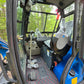 Interior cab view of Rippa R32 PRO Mini Excavator showing operator seat, pedals, and control levers – JoyT5 Canada | JoyT5