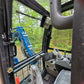 Operator view inside the Rippa R32 Mini Excavator cab showing seat, joystick controls, pedals, and boom visibility – JoyT5 Canada