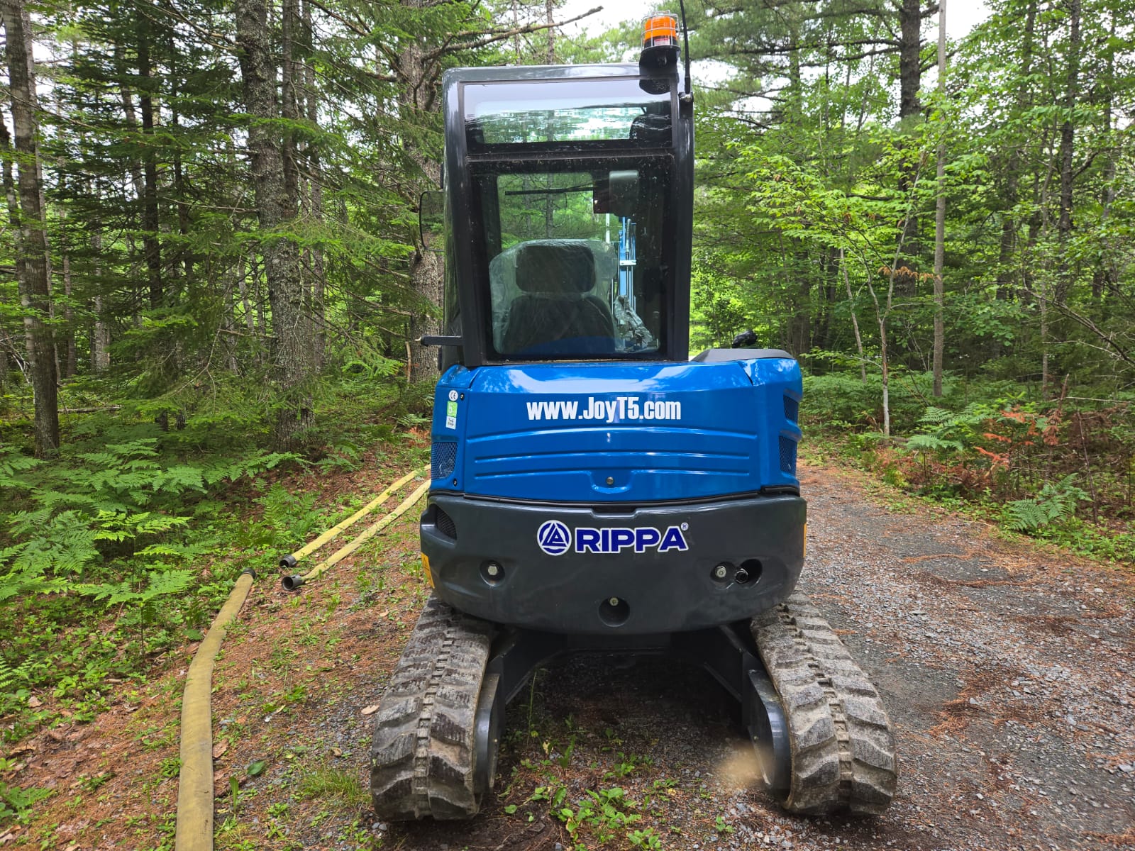 Rear view of Rippa R32 Mini Excavator in Canada, compact excavator with durable tracks and cabin