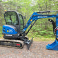 Side view of Rippa R32 Mini Excavator in Canada with hydraulic system and trenching bucket | JoyT5