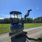 Compact rippa r15 mini excavator for sale side view with raised boom and bucket on gravel road