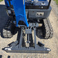 Close-up view of rippa r15 mini excavator for sale blade and track system on gravel surface