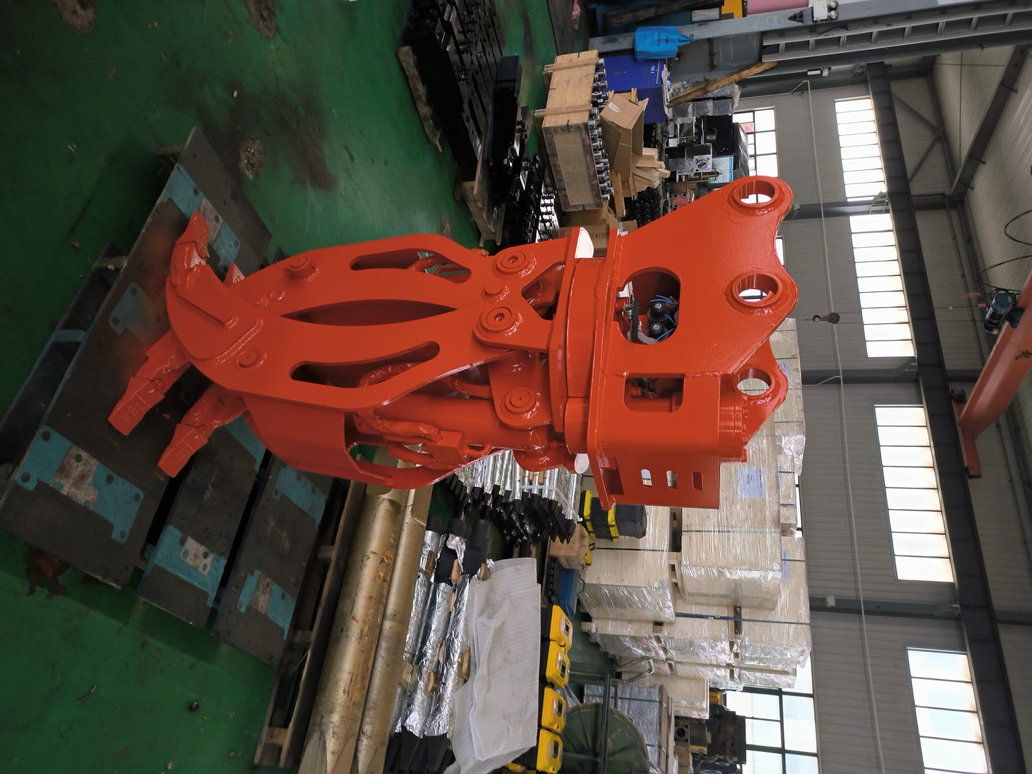 Heavy duty rotating grapple for excavator displayed in factory workshop built for demolition forestry and material handling in Canada