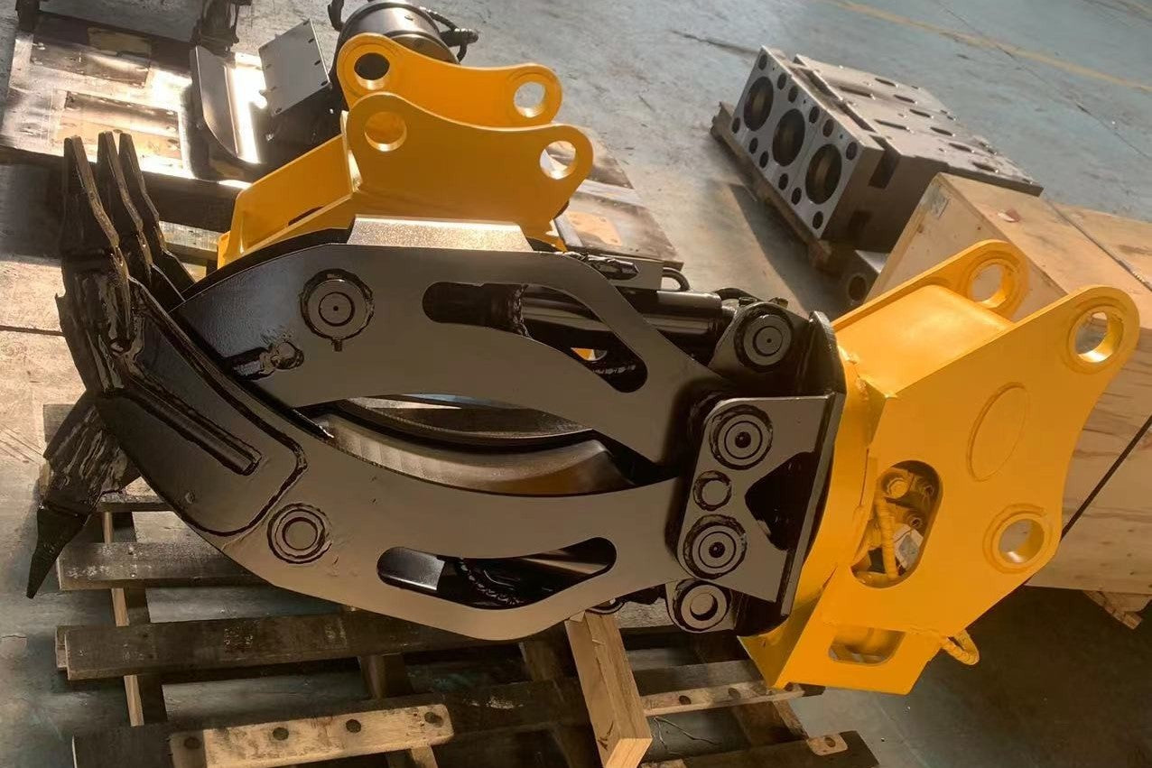 Heavy duty rotating grapple attachment for excavators designed for demolition forestry and material handling work in Canada