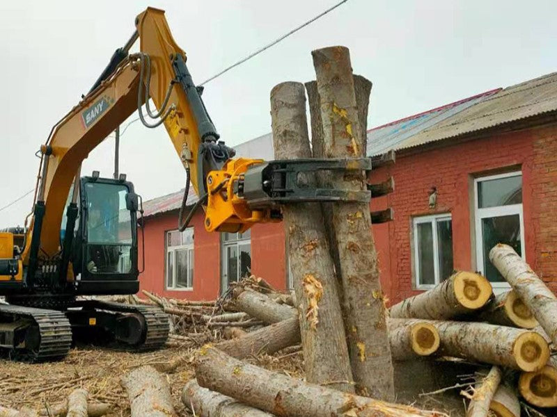 Excavator equipped with rotating grapple lifting tree logs for forestry and material handling applications in Canada



