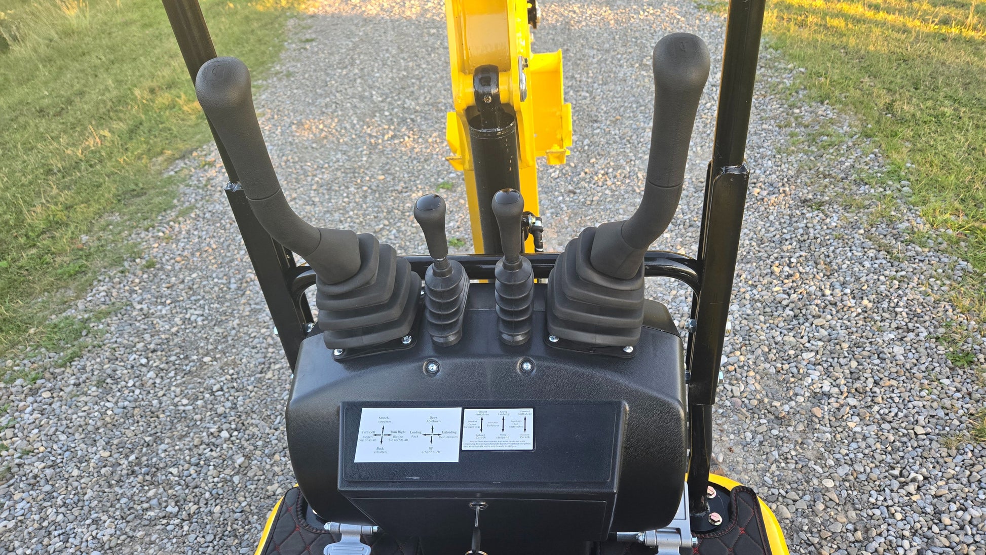YardHoe YH12 1 ton mini excavator Rippa R319 pilot joystick controls close up showing easy to use compact gasoline excavator for landscaping and construction in Canada