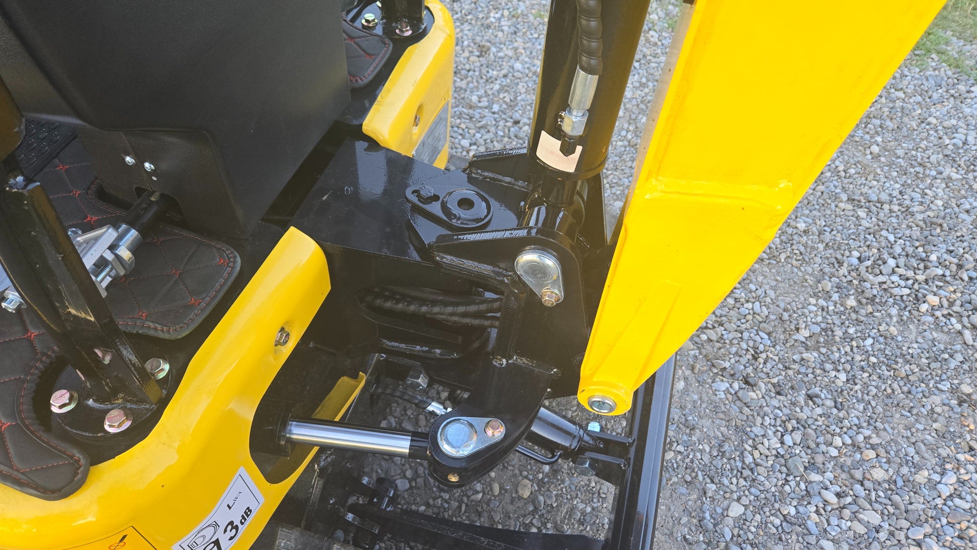 Hydraulic boom joint and pivot assembly close up on YardHoe YH12 one ton mini excavator showing strong construction and smooth control for small jobs in Canada with JoyT5 support