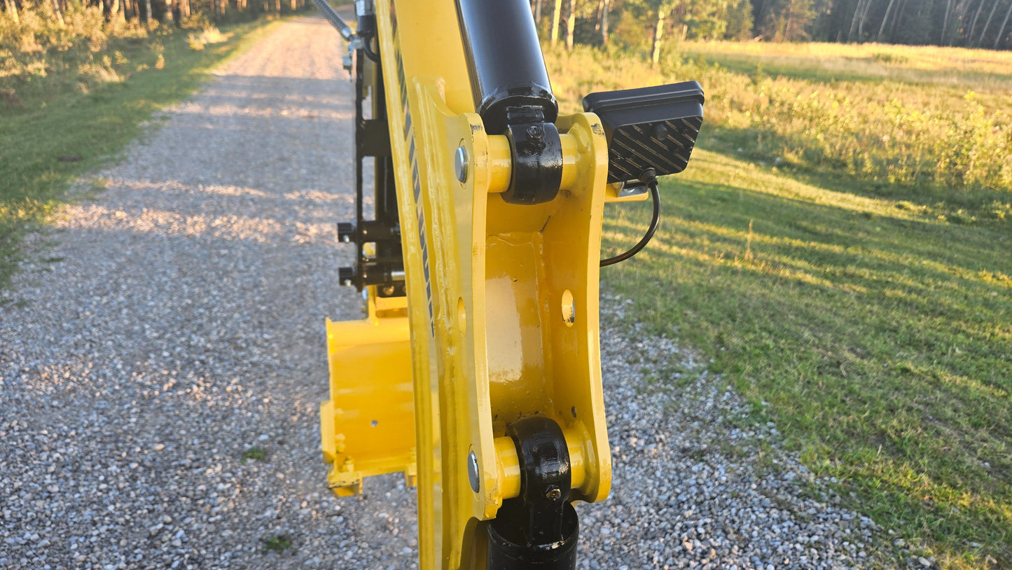 YardHoe YH12 mini excavator boom arm pivot joint and hydraulic connection close up showing durable construction for small digging work in Canada with JoyT5 support