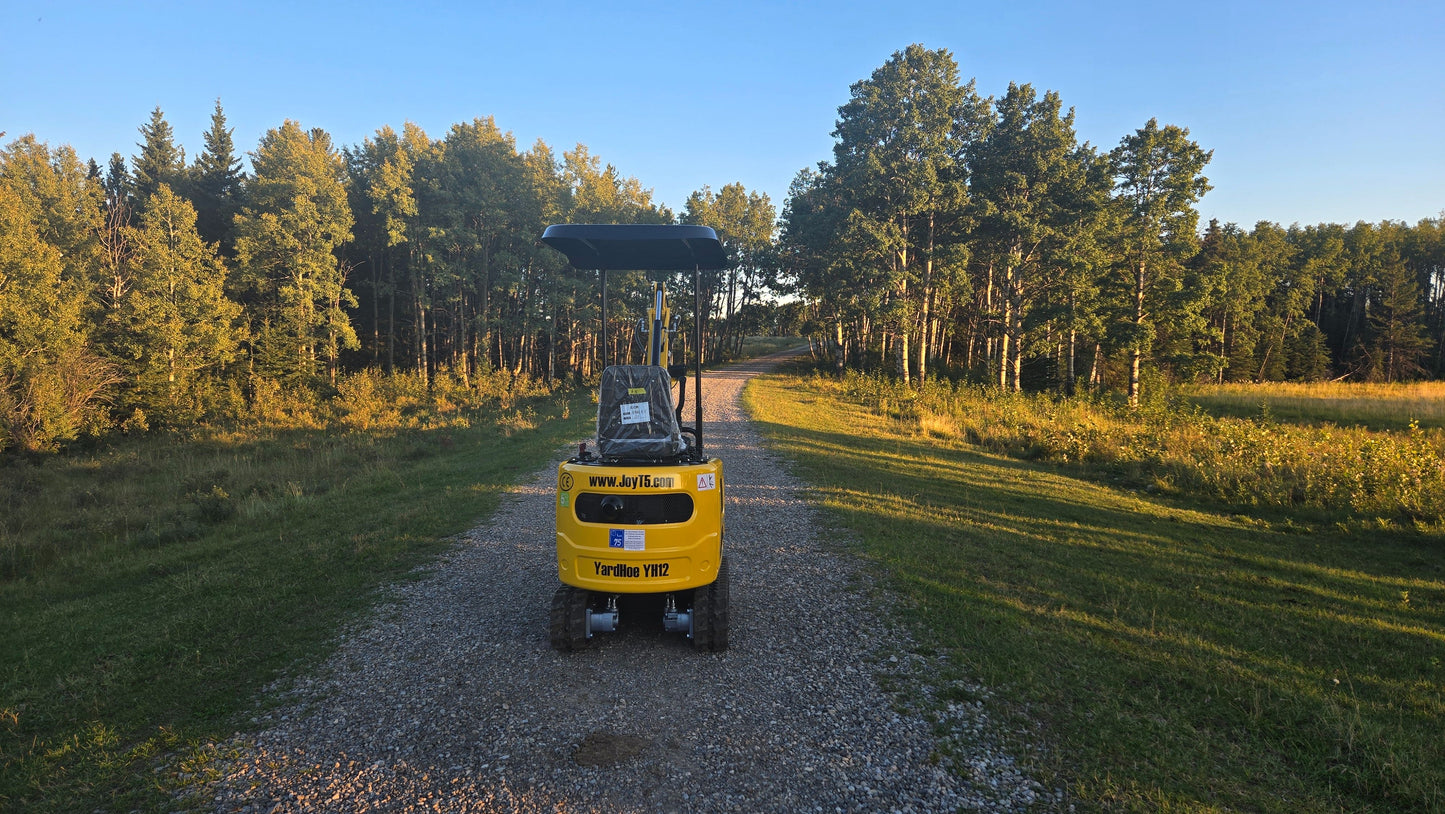YardHoe YH12 / Rippa R319 1 ton mini excavator for sale rear view on gravel road, affordable compact digger with gasoline engine in Canada and USA.
