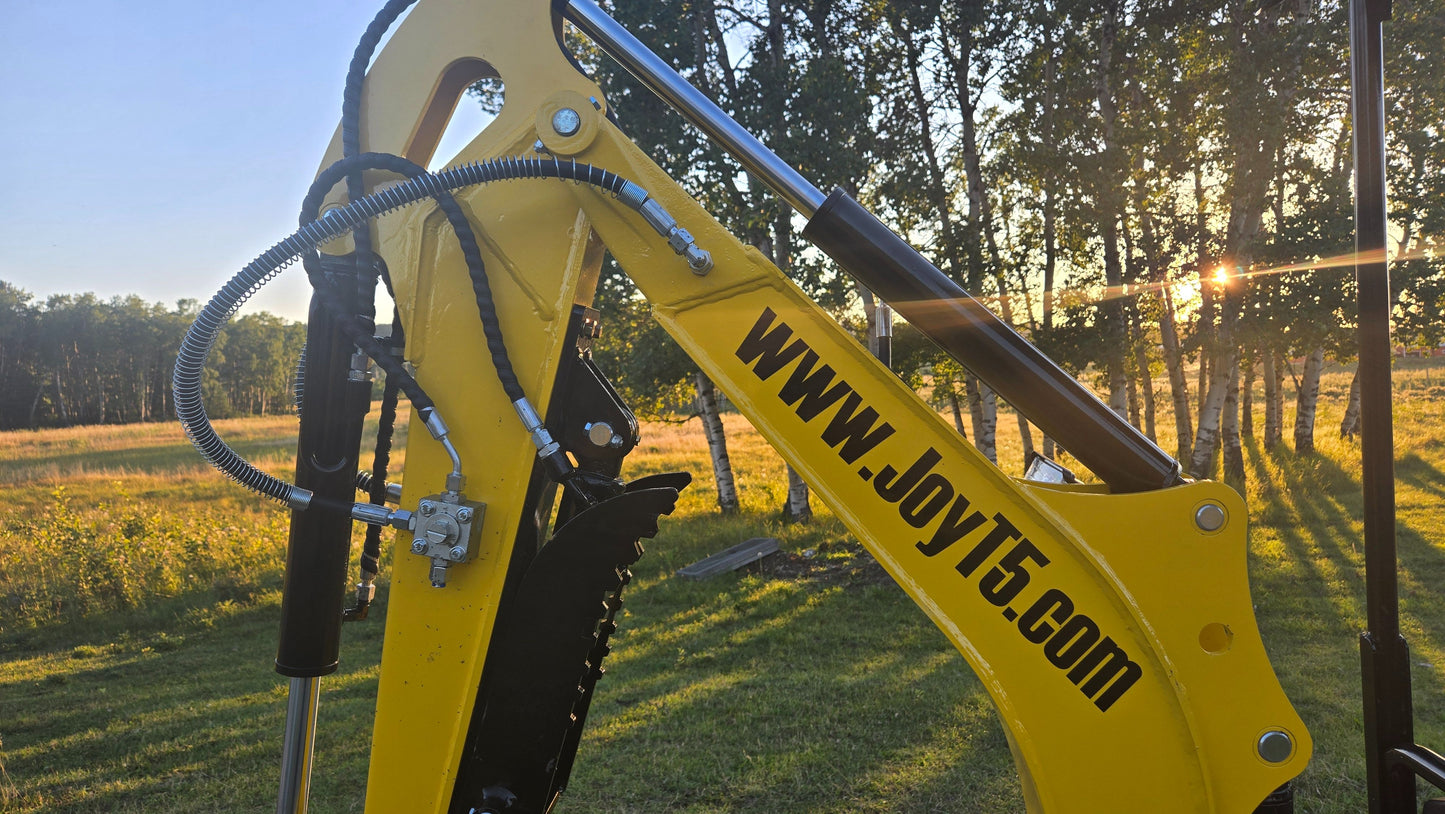 Close-up of YardHoe YH12 / Rippa R319 mini excavator boom and hydraulic arms, compact digger attachment for construction and landscaping.
